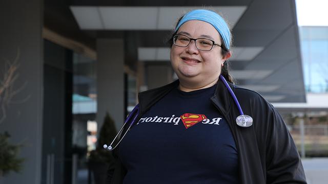 Stephanie Ghilino standing outside a hospital wearing a stethoscope